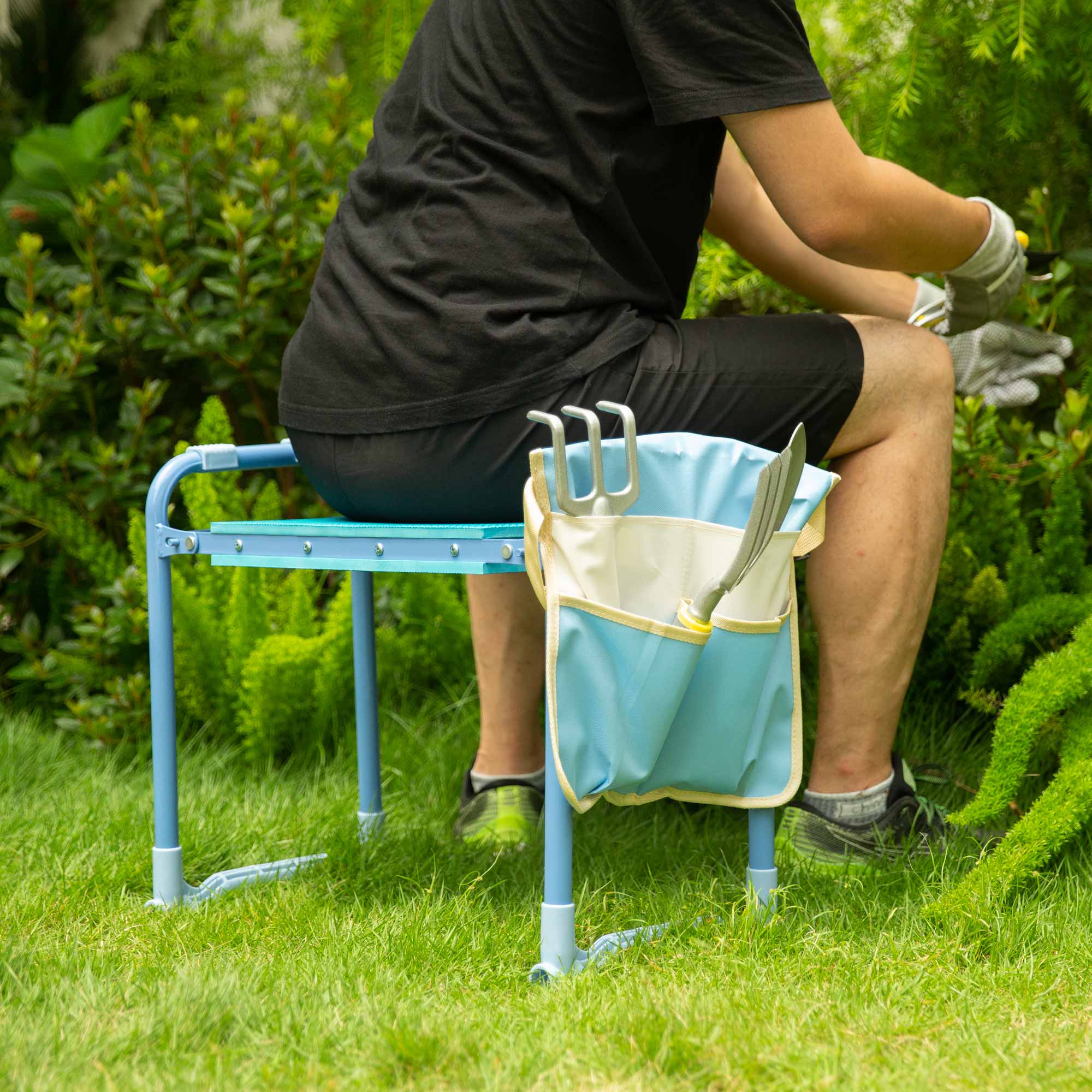 a man sits on the garden seat and kneeler 