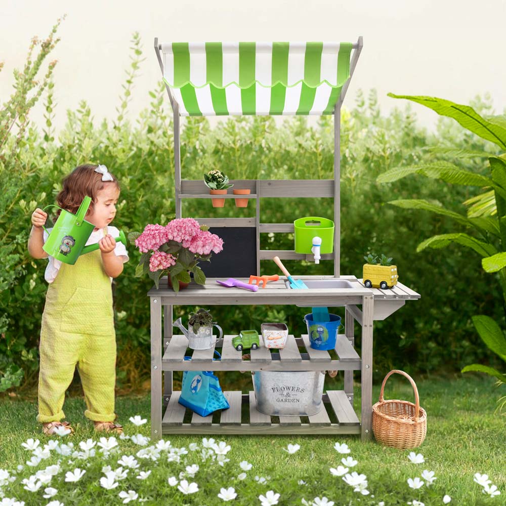 kid Potting Bench front side with kid holding the watering can